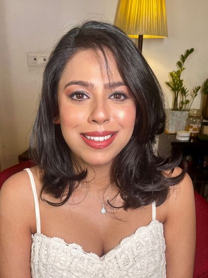A close-up of the baby shower makeup. The look is fresh, radiant, and enhances her natural beauty.