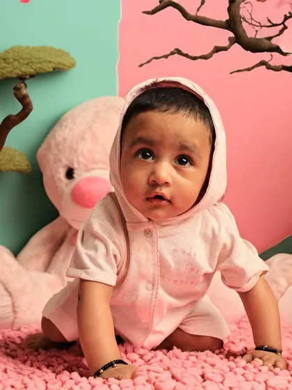 Using AI, we created a fantastical landscape around the baby, with stylized trees and a two-toned background, turning a simple photo into a fantasy scene.