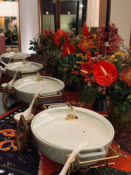 Our elegant serveware on a vibrant Shivan & Narresh printed tablecloth, creating a high-fashion Diwali dining experience.