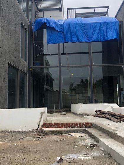 Another "before" shot of a courtyard under construction, showing the raw state of the site before the landscape intervention.