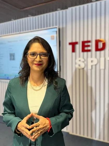 A photo of me at a TEDx SPIT event. I've learned that the moment you stop doubting and start believing you can fly, everything changes. The pen is your wing.