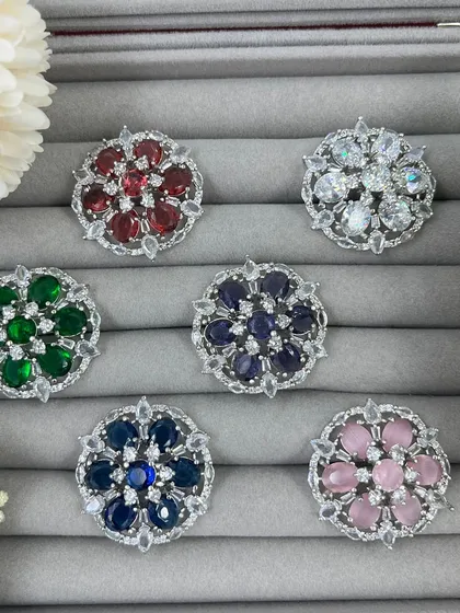 Our adjustable cocktail rings are a fast-moving item for any retailer. This video shows the variety of vibrant colors available, from ruby red to sapphire blue, all set in a floral AD Zircon design.