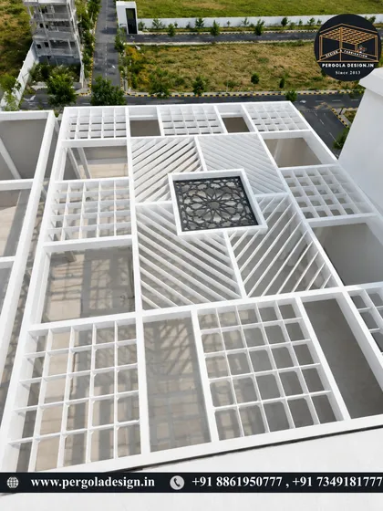 The foundation of luxury is uncompromising quality. This aerial view shows the complex geometric framework of a large-scale rooftop pergola during installation. Our precision engineering and heavy-duty steel ensure a structure that is both beautiful and built to last a lifetime.