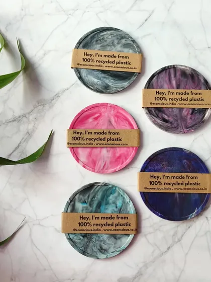 Our recycled plastic coasters are designed to be conversation starters. Each one has a unique, marble-like pattern, telling a story of sustainability every time you put down your cup. They are a small, beautiful choice for a conscious home.