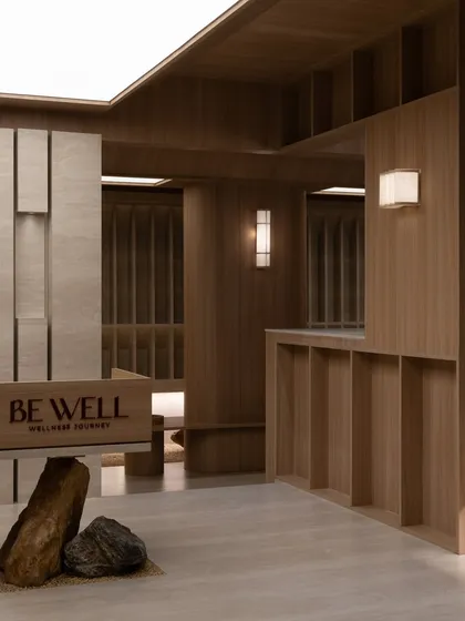 The reception area from another angle, showing the "Be Well" branding.