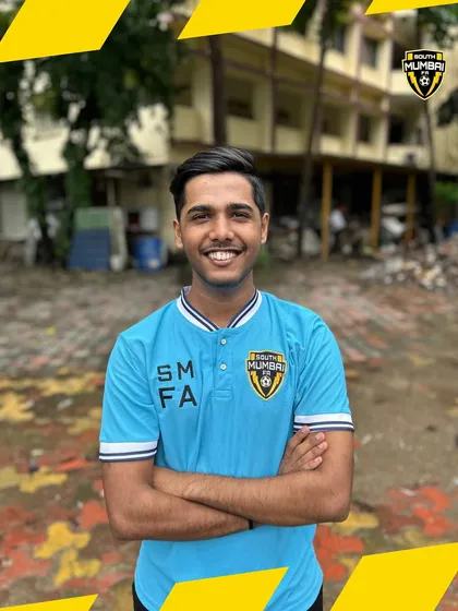 A portrait of one of our smiling coaches. Our staff brings positive energy and professional expertise to every single training session.