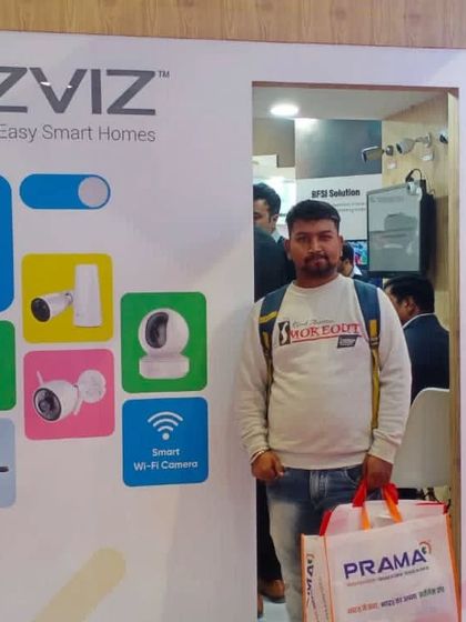 Visiting the EZVIZ booth at a recent trade show. I make it a point to get hands-on experience with the smart home security products I recommend and install.