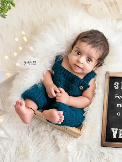 "Feeling cute, might have a meltdown later." This little chalkboard sign adds a touch of humor to this three-month milestone session, and his cheeky smile is just perfect.