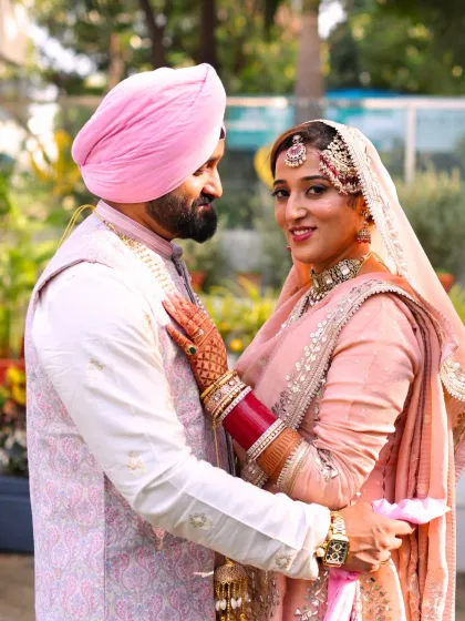 An intimate portrait of the couple. The bride's makeup is subtle yet stunning, with defined eyes and a natural, glowing complexion.