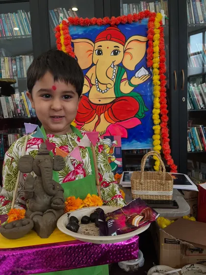 The joy of completing a project! This little one is thrilled with his eco-friendly Ganesha, ready for the festival.