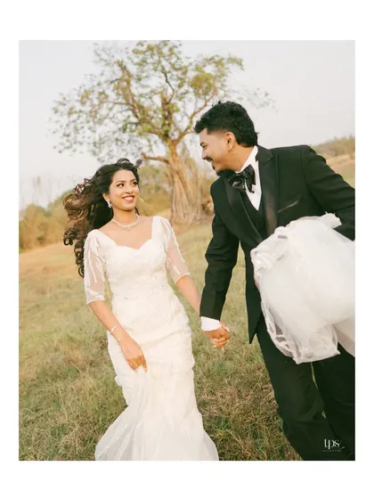 A candid moment of laughter and movement. The bride and groom's joyful interaction in a natural setting showcases our ability to capture authentic, unposed happiness.