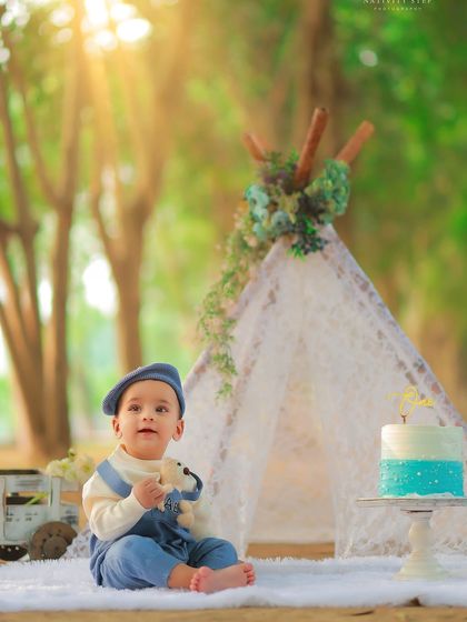 This little boy, dressed in a cute blue beret and overalls, is ready for his outdoor birthday celebration. We help style your child's look to match the theme of the shoot.