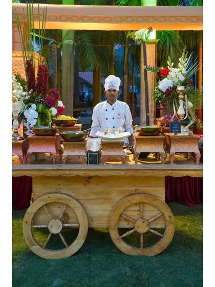 A rustic wooden food cart, perfect for outdoor or garden-themed events. Here it's being used as a live chaat station, adding to the authentic vibe.