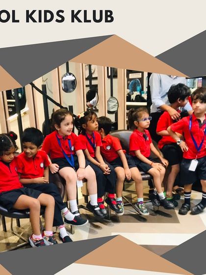 The group of children sitting together, excited for their turn to get a fun new haircut.