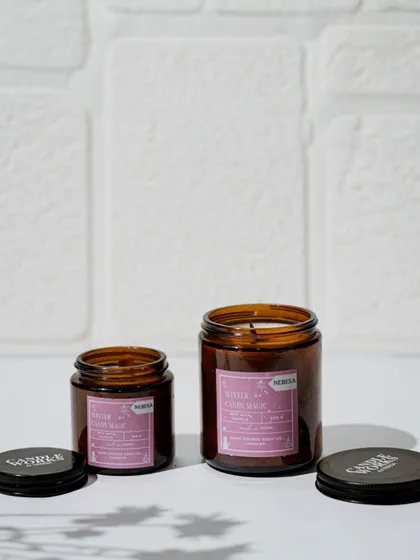 My "Winter Candy Magic" candle is a festive and sweet fragrance that I bring out for the holiday season. Poured in an amber jar, its warm glow and delightful scent make any space feel cozy and cheerful.