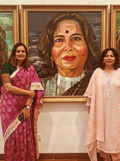 At the art gallery in Delhi, standing beside a portrait of me. It's humbling to see one's work recognized in such a creative way.