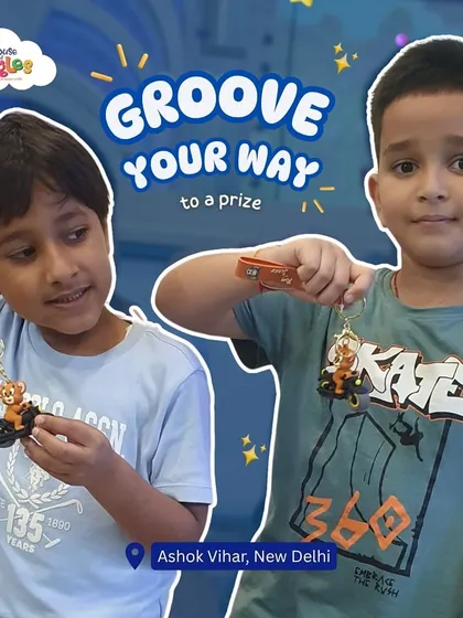 Groove your way to a prize! After a fun session at the arcade, these two friends proudly show off the cool keychains they won. At our place, playing hard pays off with awesome rewards.