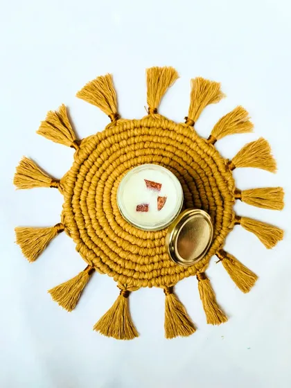 My sunburst placemats are not just for the dining table. Here, it serves as a beautiful base for a candle, creating a cozy and decorative centerpiece. I love seeing the creative ways you use my work in your homes.