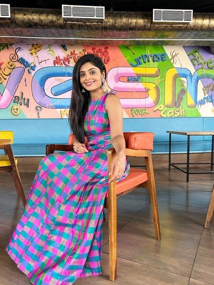 Actress Bhavanaa Raao looking confident and alluring in a custom-designed multi-color checkered gown.