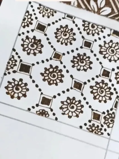 A practice swatch of a geometric filler pattern with spiral flowers.