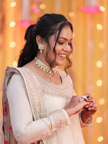 Another lovely candid moment. The soft, romantic hairstyle with a simple ponytail is perfect for a guest look.