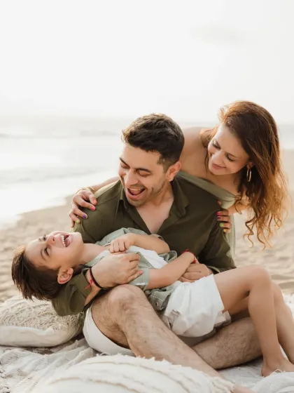 A moment of pure laughter as a family plays on the beach. These unposed, candid moments are my favorite to capture.