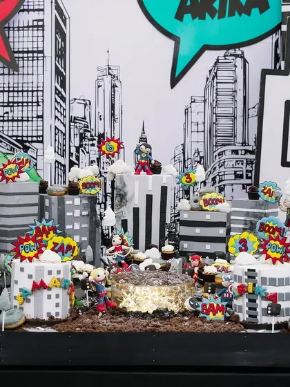 This was our biggest dessert table project, a whole city of superheroes! For this party, we created an entire edible cityscape where guests could pick up and eat the buildings, cookies, and cake pops. It was so much fun to design and build.
