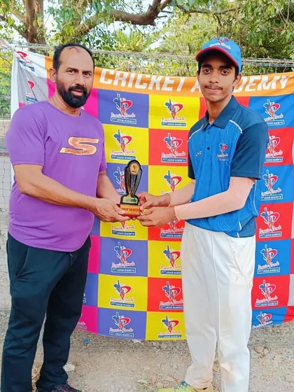 A U-14 player is recognized for his match-winning contribution with a Man of the Match trophy.