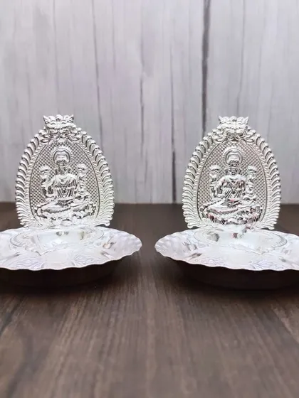 A pair of German silver Lakshmi arch diyas, small and perfect for placing on either side of a main idol.