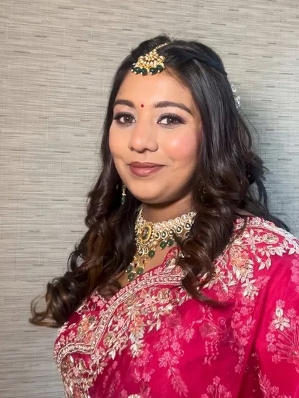 A beautiful, glowing look for this client. The makeup is elegant and refined, with a focus on enhancing her features for a polished and sophisticated appearance.