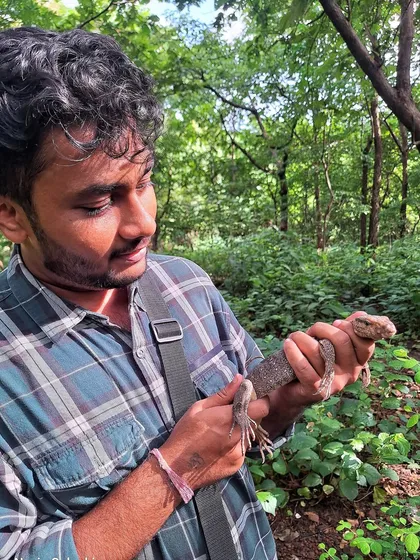 A personal moment, holding a rescued monitor lizard. This image was part of a feature on my work, connecting my passion for photography with my roots in wildlife rescue.