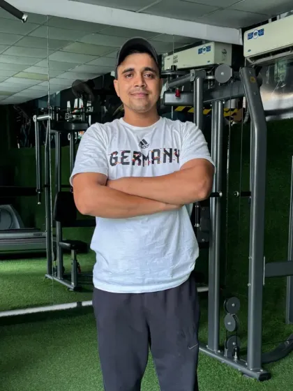 In my element at the gym, surrounded by the tools of the trade.