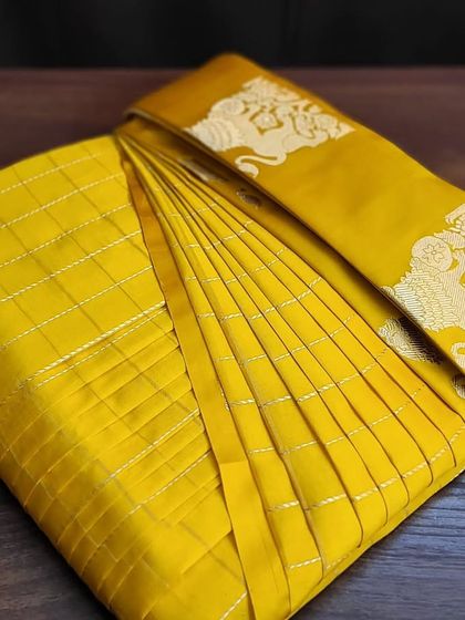 The final, ready-to-store pre-pleated and folded saree.