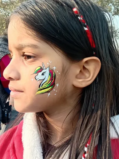 Bringing a little magic to life with this colorful unicorn face paint. This is a huge hit at kids' parties and family-friendly festivals. I can customize the colors to match any theme or outfit, and it's all done with gentle, hypoallergenic paint.