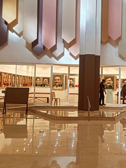 A view of the Nehru Centre Art Gallery, where I was delighted to find my portrait featured among other TV panelists.