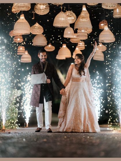 Another shot of the couple's sparkler entrance, capturing their joy and the magical atmosphere we created with lighting and pyrotechnics.