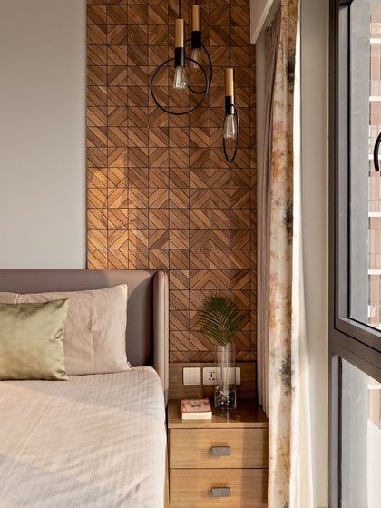 A closer look at the natural wood tile panel in the bedroom. The geometric pattern adds a modern touch to the organic material.
