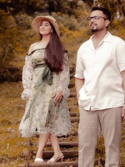 Another look at the custom floral organza dress, highlighting its delicate print and airy silhouette. I work with couples to style both partners, ensuring their outfits complement each other and the overall theme of their shoot.