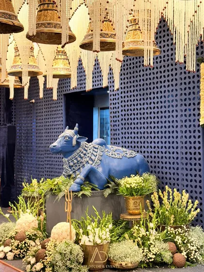 A testament to artistry and devotion, this shot from a Ganesh Chaturthi celebration features a sculpted Nandi bull set against a backdrop of hanging temple bells. It showcases my ability to create deeply meaningful and luxurious decor for any occasion.