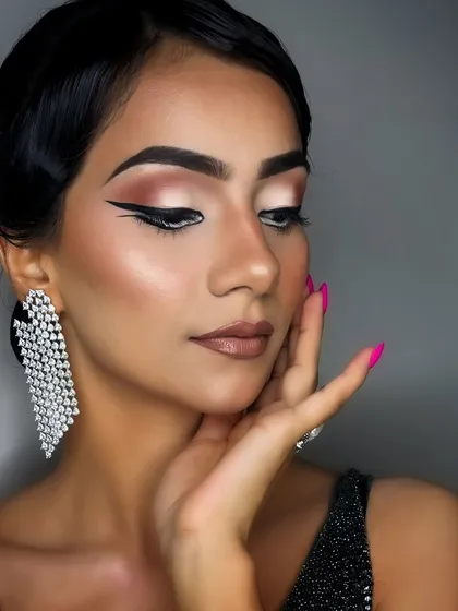 A softer-angled shot of the same look, showing how the makeup appears with eyes looking down, highlighting the eyeshadow blend.