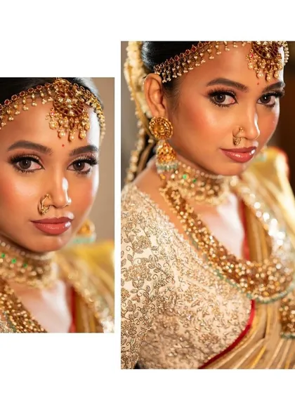 A close-up of a bride's stunning makeup and her custom embroidered blouse. The off-white blouse is covered in intricate work, perfectly complementing her gold Kanchipuram saree.