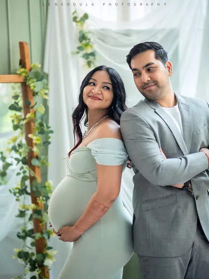 A playful back-to-back pose that shows your connection and shared excitement as you wait to meet your little one.