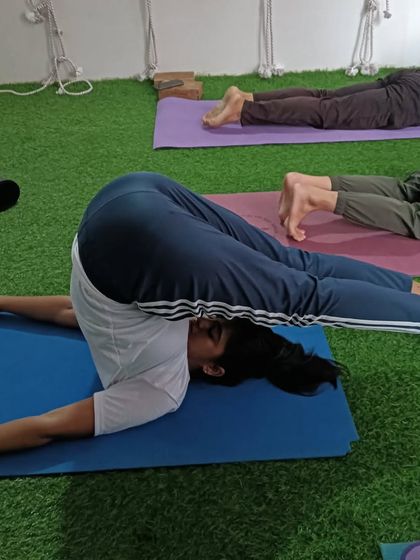 Halasana, or Plow Pose. This inversion provides a deep stretch for the entire spine and the back of the legs.