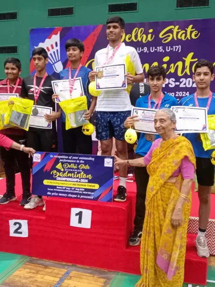 Another angle of the boys' team receiving their prizes. Every player on that podium has put in the hours and earned their spot.