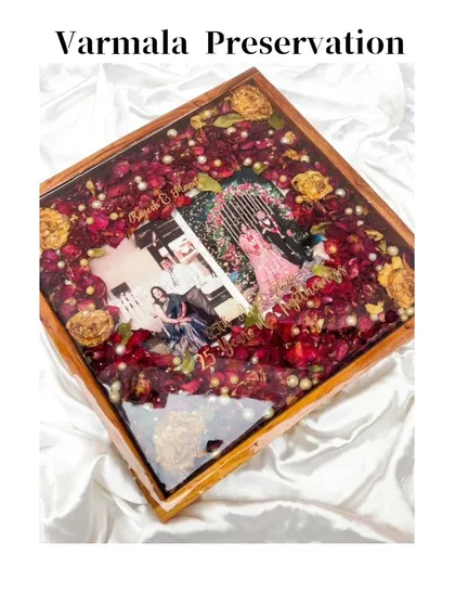 These images and videos showcase various angles and the creation process of my custom wedding and anniversary varmala preservation frames. Each one is made with love to turn your special memories into a timeless treasure.