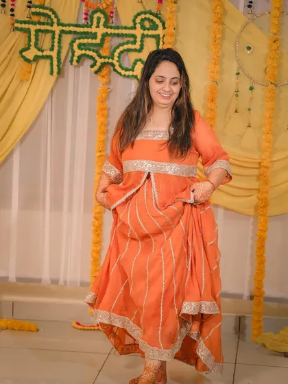 A candid shot of the bride dancing and enjoying her Mehandi function.