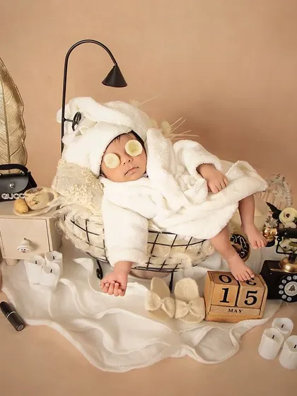 A day of pampering for the little princess. This spa day theme is one of my favorites, featuring a tiny bathrobe, cucumber slices, and miniature beauty products for a super cute shot.