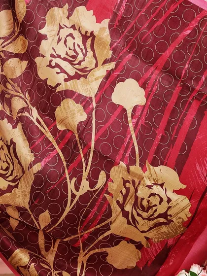 A detailed shot of the golden rose print on the saree's pallu, a beautiful example of our "Printed Poetry" collection.