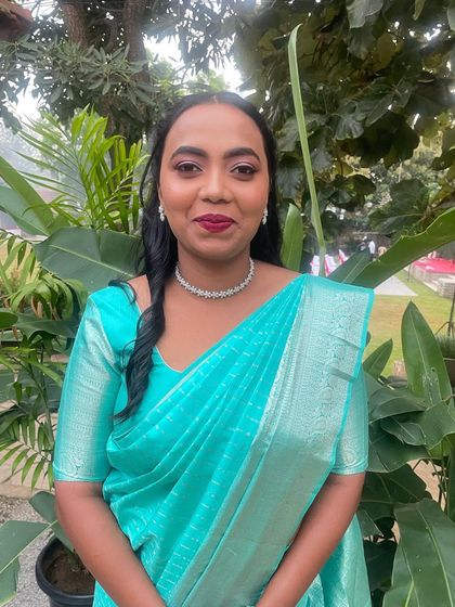 Simran's elegant ring ceremony look. I used a classic red lip and subtle eye makeup to complement her bright turquoise saree and diamond jewellery.