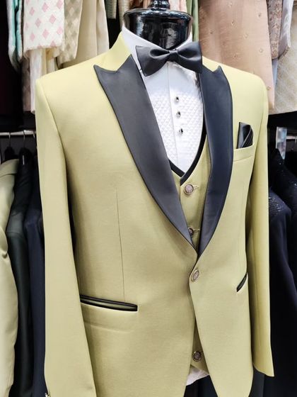 A collection of our designer suits, showcasing a variety of colors, fabrics, and custom details like embroidery, unique lapels, and accessories. Each piece is crafted to make a lasting impression.